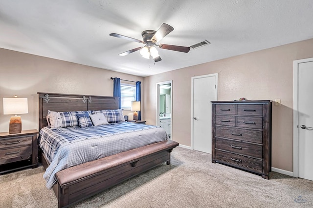 2512 Sinclair Ave, Midland, TX 79705 - bedroom with carpet, ensuite bath, baseboards, and a ceiling fan