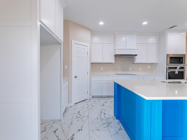 kitchen with white cabinetry, black electric stovetop, sink, stainless steel oven, and built in microwave