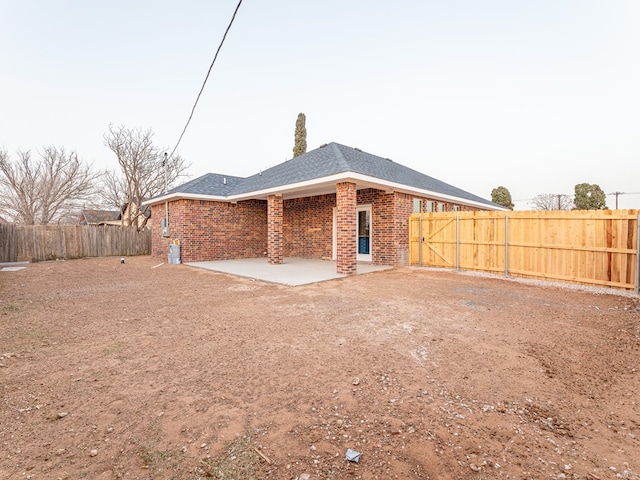 rear view of property featuring a patio area