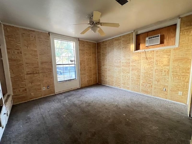 unfurnished room featuring dark colored carpet, ceiling fan, and a wall unit AC