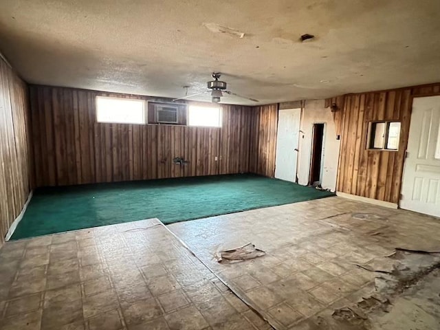 spare room featuring wooden walls