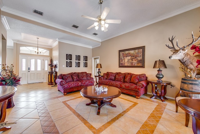 5500 Heartland Ct, Midland, TX 79707 - living room featuring light tile patterned floors, ornamental molding, a ceiling fan, inlaid floor details, and a raised ceiling