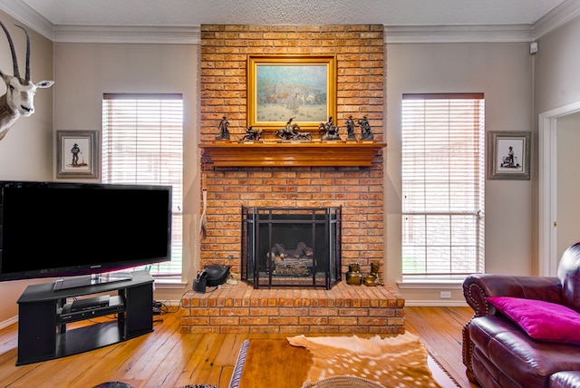 5500 Heartland Ct, Midland, TX 79707 - living room with wood-type flooring, a brick fireplace, and crown molding