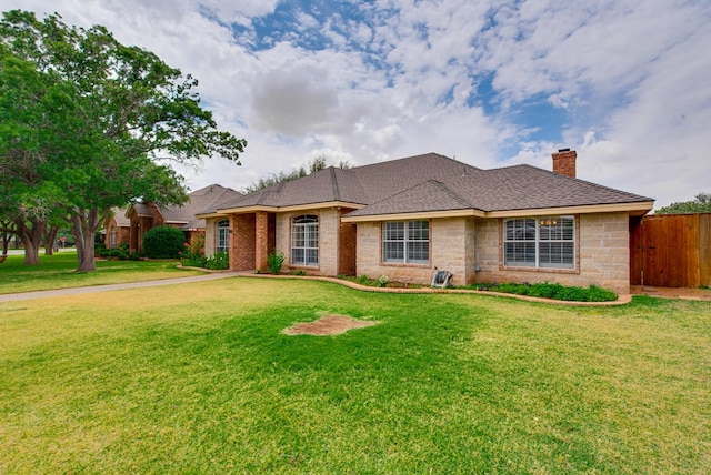 5500 Heartland Ct, Midland, TX 79707 - ranch-style house with a chimney, a shingled roof, and stone siding