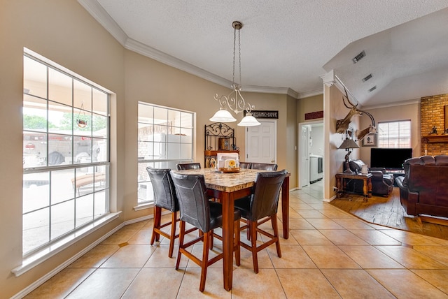 5500 Heartland Ct, Midland, TX 79707 - dining area featuring light tile patterned floors, ornamental molding, and a textured ceiling