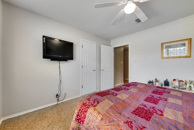 5500 Heartland Ct, Midland, TX 79707 - bedroom featuring a textured ceiling, carpet flooring, and ceiling fan