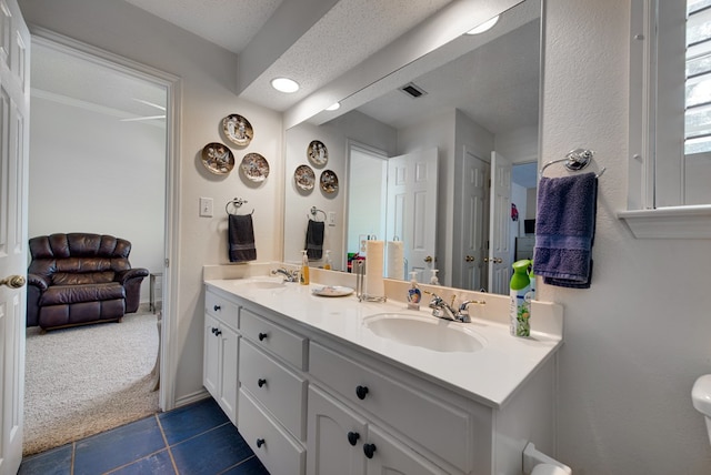5500 Heartland Ct, Midland, TX 79707 - full bathroom with double vanity and tile patterned flooring