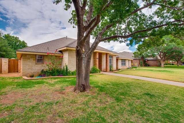 5500 Heartland Ct, Midland, TX 79707 - ranch-style house featuring stone siding and a shingled roof