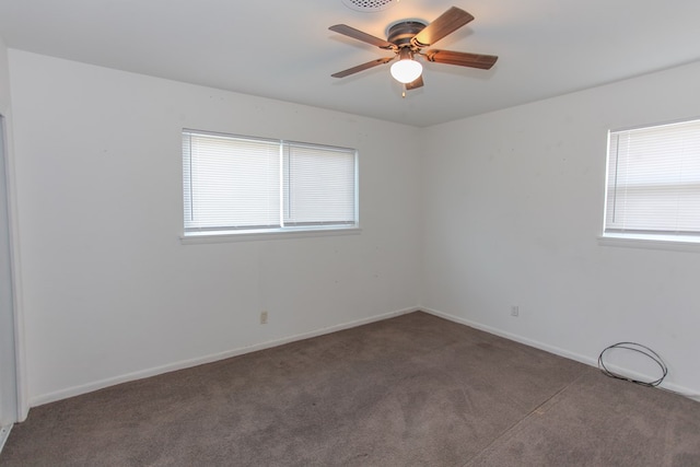 carpeted empty room featuring ceiling fan