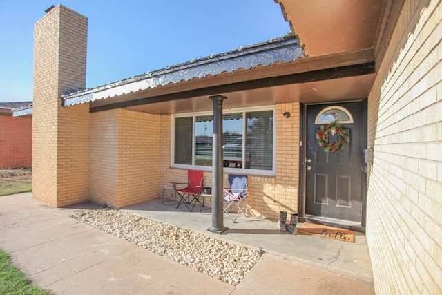 property entrance featuring covered porch