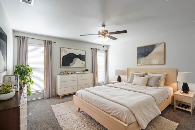 bedroom with ceiling fan, carpet, and visible vents