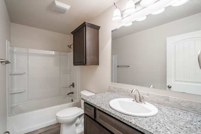 full bath featuring toilet, wood finished floors, vanity, visible vents, and shower / bathing tub combination