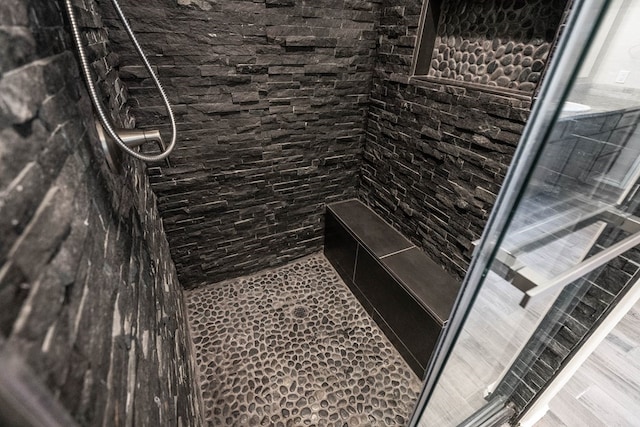 interior space featuring tiled shower