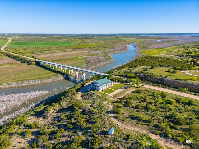 drone / aerial view featuring a rural view and a water view