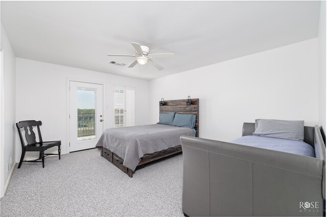 bedroom featuring ceiling fan, access to exterior, and light carpet