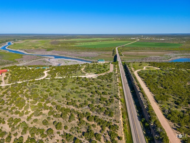 birds eye view of property with a rural view