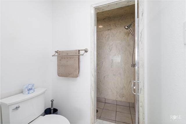 bathroom with tile patterned flooring and toilet