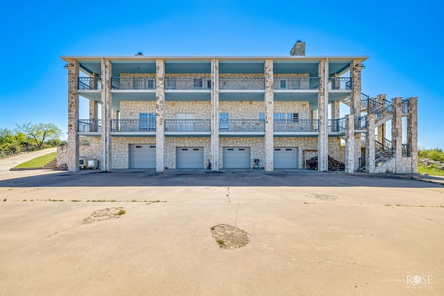 exterior space with a balcony and a garage