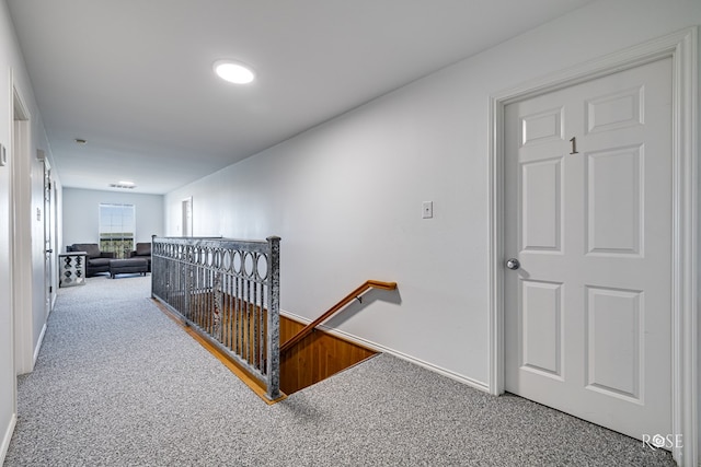 corridor featuring carpet flooring