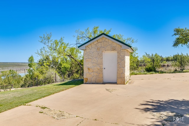 view of outbuilding featuring a yard