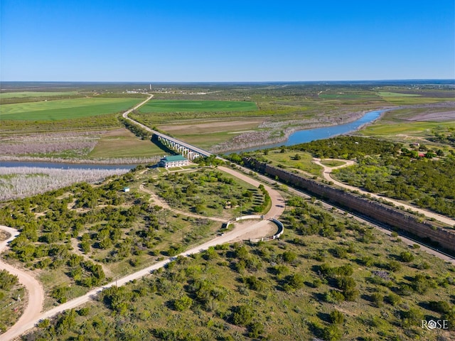 birds eye view of property with a water view and a rural view