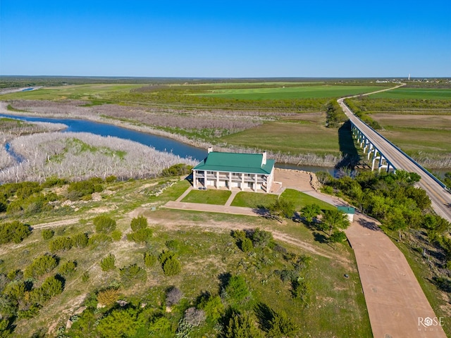 birds eye view of property featuring a rural view and a water view