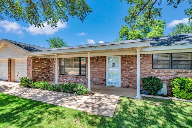 2310 W Shandon Ave, Midland, TX 79705 - ranch-style house featuring covered porch, brick siding, and an attached garage