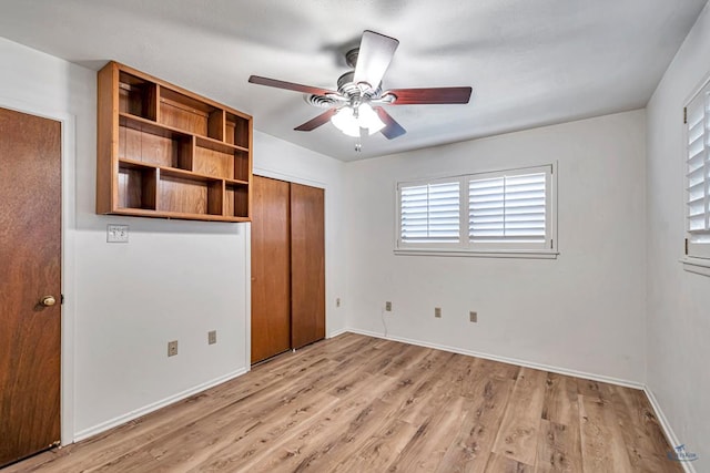 2310 W Shandon Ave, Midland, TX 79705 - unfurnished bedroom with light wood-style floors, baseboards, and a closet