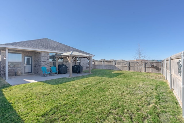 view of yard featuring a gazebo and a patio area