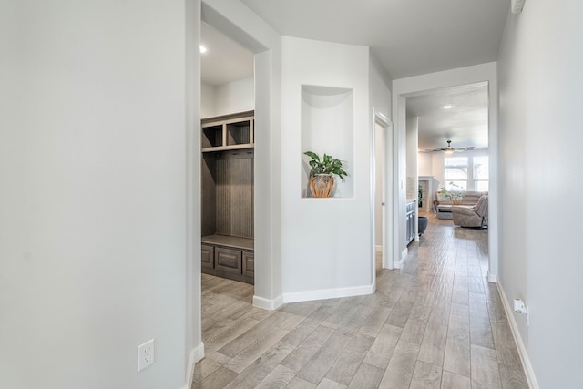 hall with light wood-type flooring