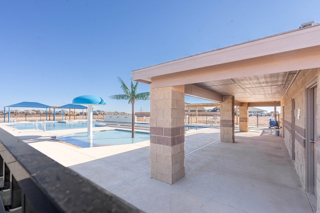 view of swimming pool with a patio area