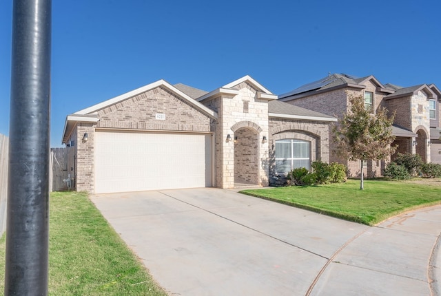 view of front facade with a front lawn and a garage