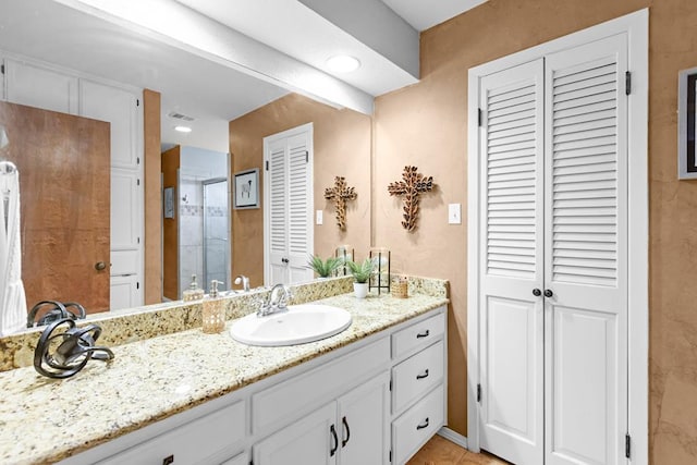 6413 Piedmont Dr, Odessa, TX 79762 - full bath with a closet, vanity, an enclosed shower, and tile patterned flooring