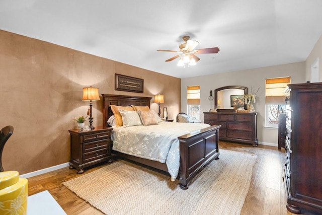 6413 Piedmont Dr, Odessa, TX 79762 - bedroom with wood finished floors and a ceiling fan
