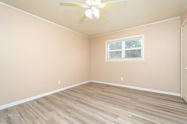 spare room featuring light wood-type flooring, ceiling fan, and ornamental molding