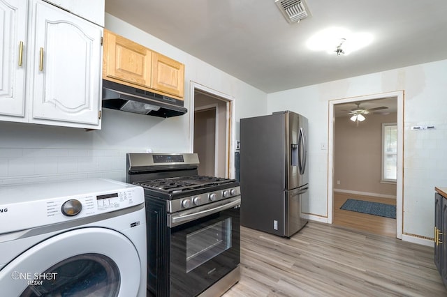 kitchen featuring appliances with stainless steel finishes, light wood-type flooring, ceiling fan, white cabinets, and washer / clothes dryer