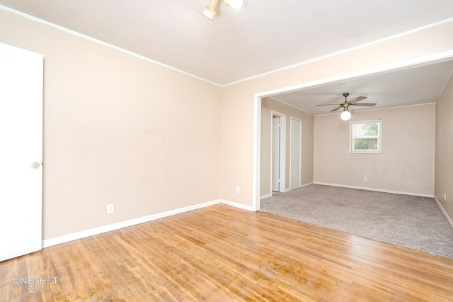 unfurnished room with ceiling fan and light wood-type flooring