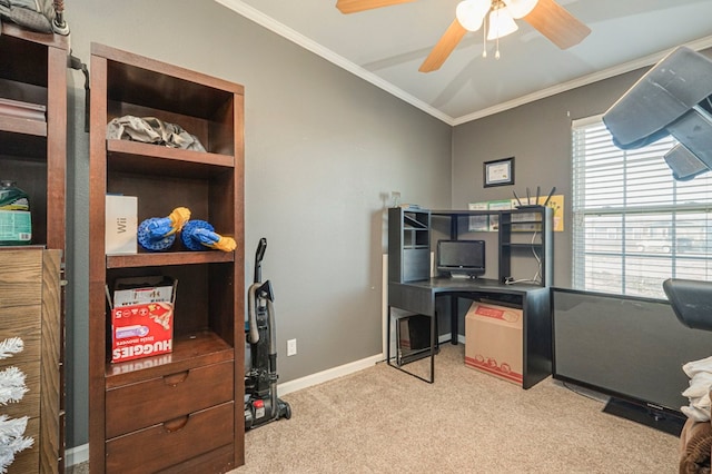 carpeted office space with crown molding and ceiling fan