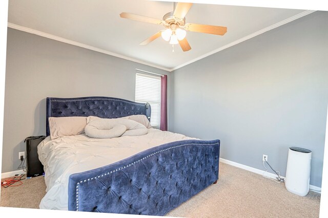 carpeted bedroom with ceiling fan and crown molding