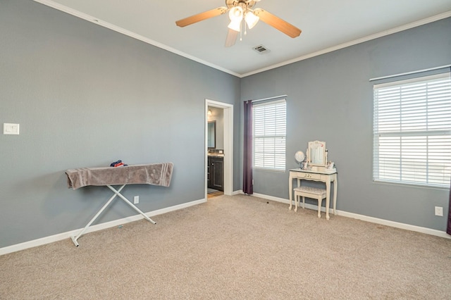 miscellaneous room featuring ceiling fan, crown molding, and light carpet