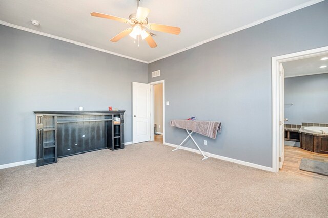 miscellaneous room with ceiling fan, light colored carpet, and ornamental molding