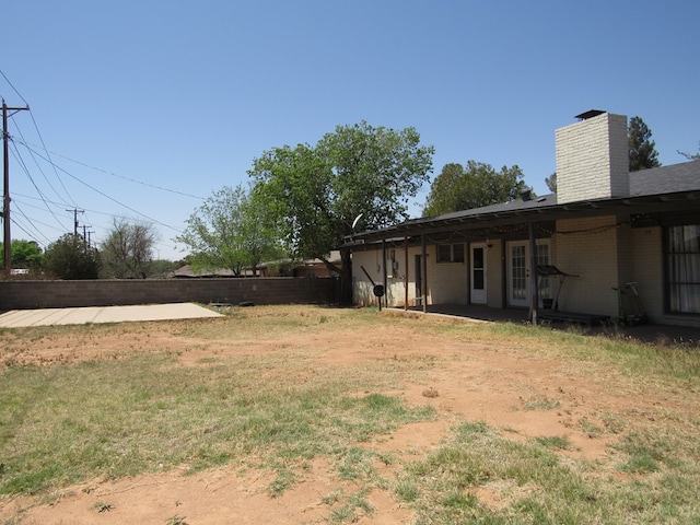 view of yard featuring a patio area and fence