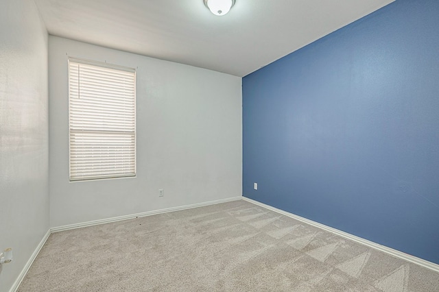 empty room featuring light carpet