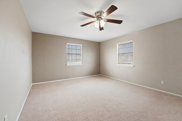 unfurnished room featuring light carpet and ceiling fan