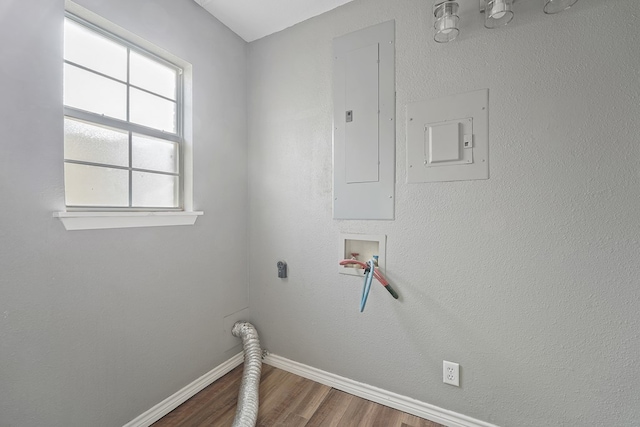 laundry room featuring wood-type flooring, hookup for an electric dryer, washer hookup, and electric panel