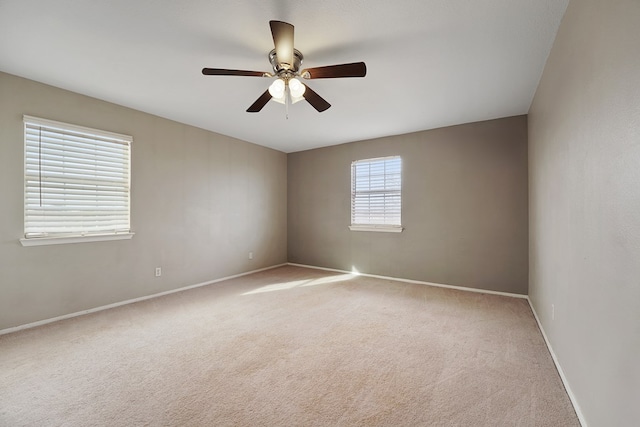 carpeted empty room with ceiling fan