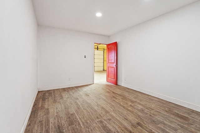 spare room featuring hardwood / wood-style flooring