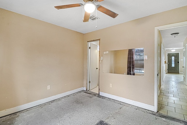 spare room with ceiling fan