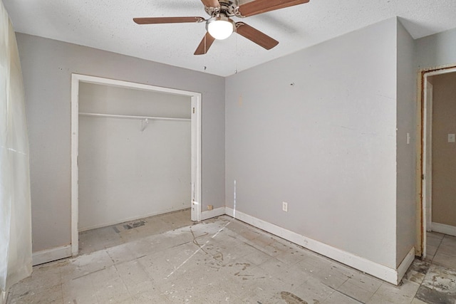 unfurnished bedroom with a closet and ceiling fan