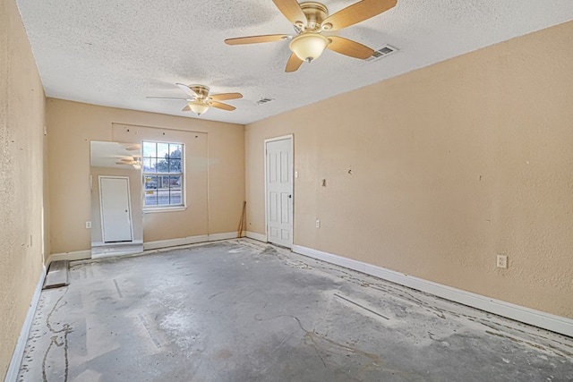 empty room featuring concrete flooring and a textured ceiling